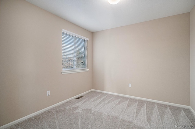 unfurnished room featuring carpet flooring