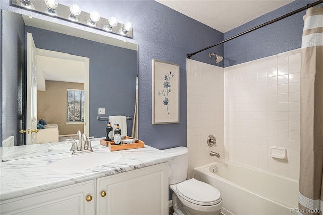 full bathroom featuring vanity, shower / tub combo, and toilet