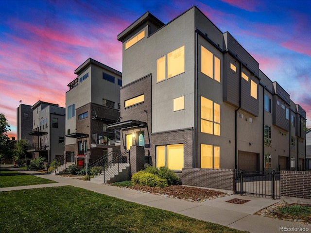 1819 Gaylord St, Denver, CO 80206 - view of front of house featuring stucco siding and brick siding