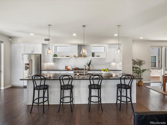 1819 Gaylord St, Denver, CO 80206 - kitchen with dark countertops, high quality fridge, dark wood-style flooring, tasteful backsplash, and recessed lighting