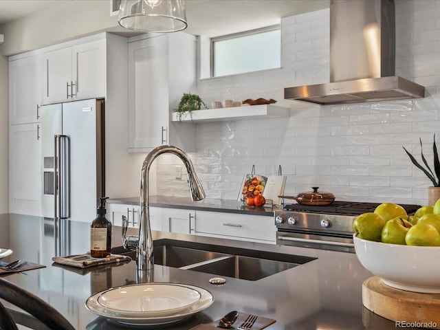 1819 Gaylord St, Denver, CO 80206 - kitchen featuring wall chimney exhaust hood, high quality fridge, dark countertops, white cabinets, and decorative backsplash