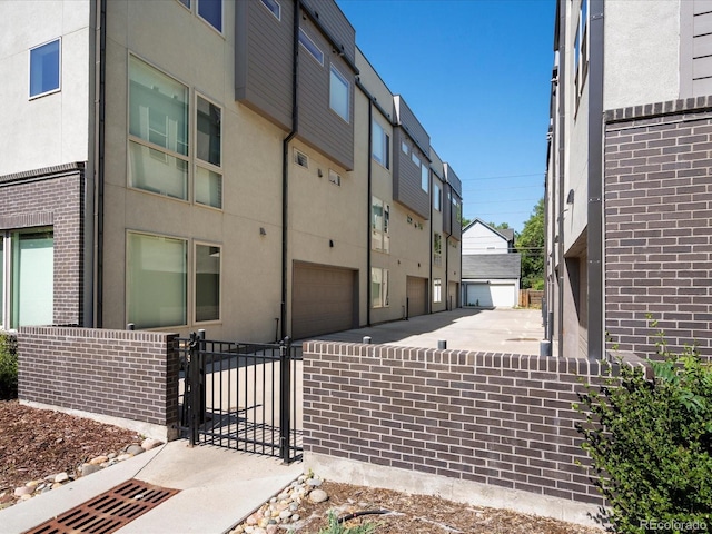 1819 Gaylord St, Denver, CO 80206 - view of property featuring a garage and a residential view
