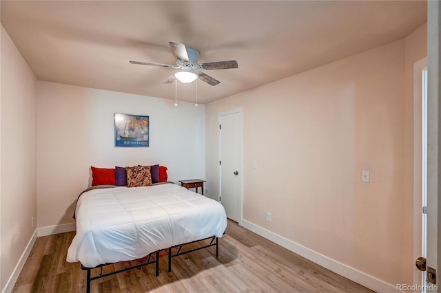 919 S Dawson Way Unit 14, Aurora, CO 80012 - bedroom with light wood finished floors and ceiling fan