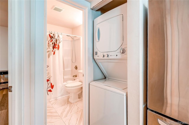 919 S Dawson Way Unit 14, Aurora, CO 80012 - laundry room with stacked washer and clothes dryer