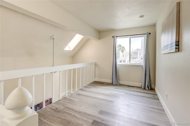 919 S Dawson Way Unit 14, Aurora, CO 80012 - additional living space featuring a skylight and wood finished floors