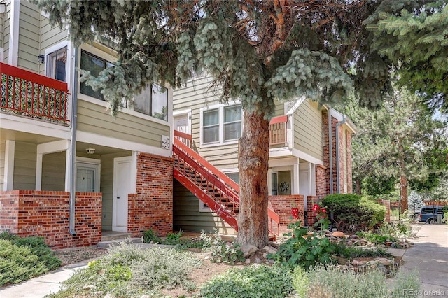 919 S Dawson Way Unit 14, Aurora, CO 80012 - view of front of home with brick siding and stairs