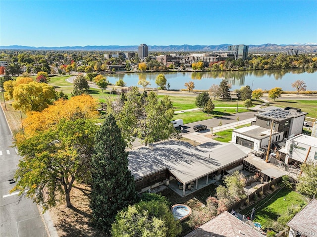 drone / aerial view featuring a water and mountain view