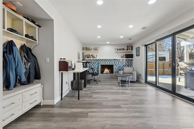 interior space featuring hardwood / wood-style flooring and a fireplace