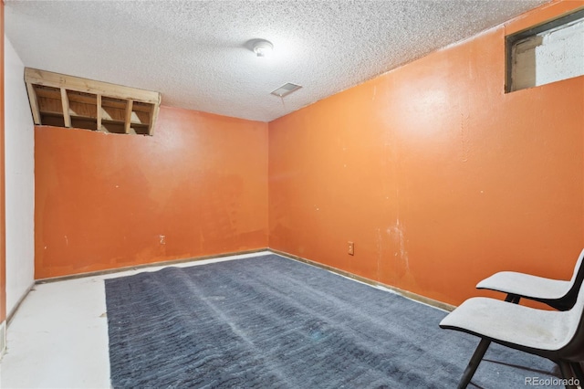 interior space with a textured ceiling