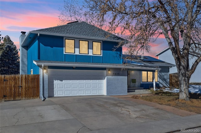 front of property with a garage