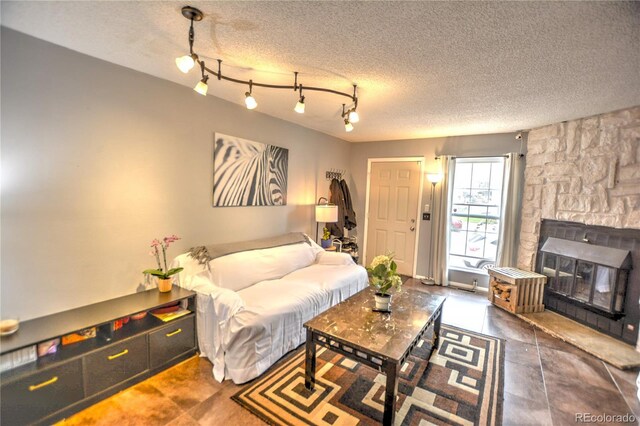 3643 Queen Anne Way, Colorado Springs, CO 80917 - living area with a fireplace and a textured ceiling