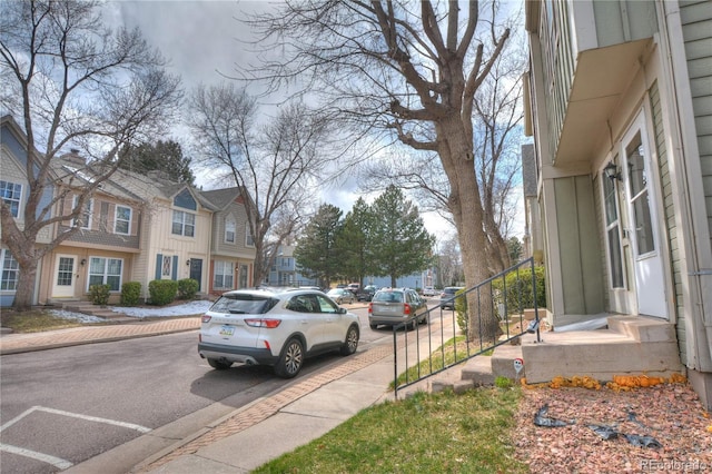3643 Queen Anne Way, Colorado Springs, CO 80917 - view of asphalt road featuring sidewalks, a residential view, and curbs