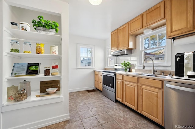 kitchen featuring sink, light tile patterned floors, and stainless steel appliances