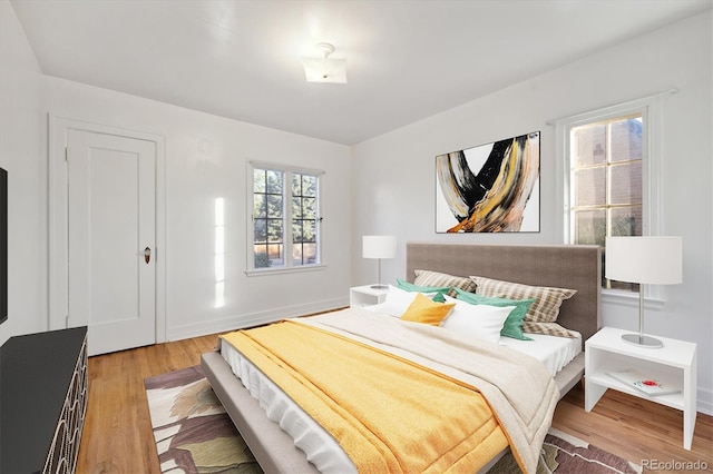 bedroom with light hardwood / wood-style flooring