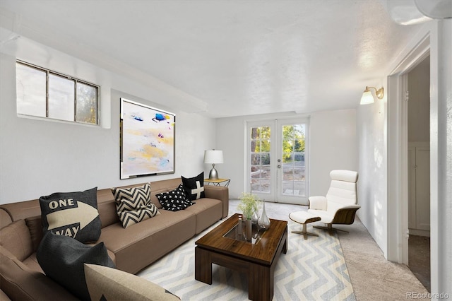 carpeted living room with french doors