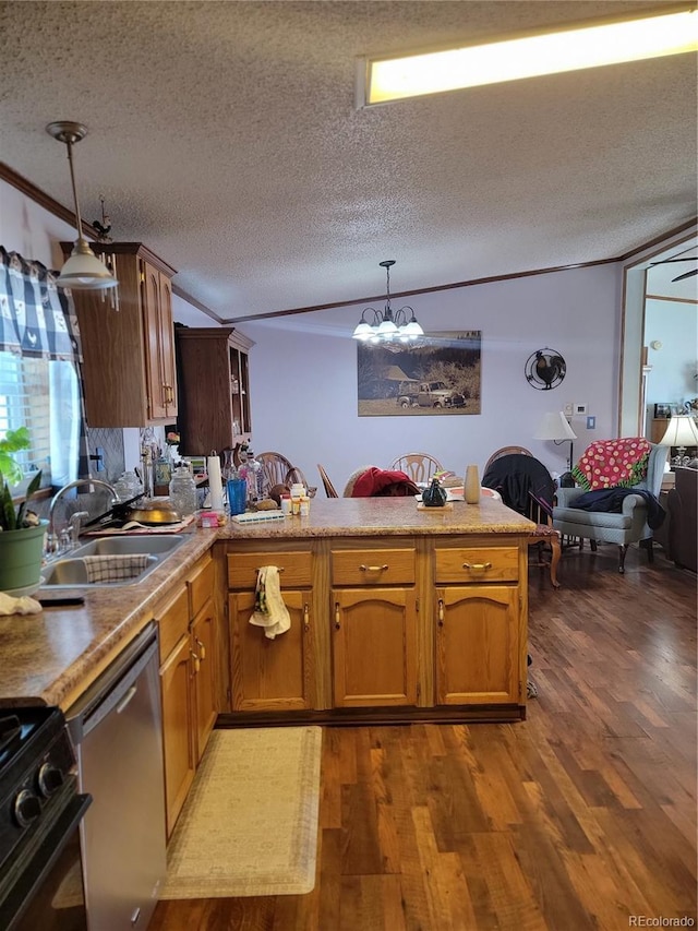 kitchen featuring hanging light fixtures, black gas range, open floor plan, a sink, and dishwasher