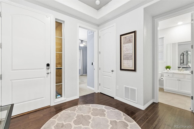 18922 W 84th Ave, Arvada, CO 80007 - entrance foyer featuring a ceiling fan, baseboards, visible vents, and wood finished floors