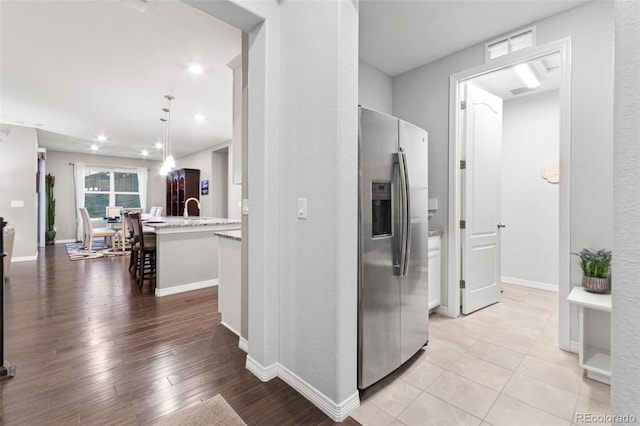 18922 W 84th Ave, Arvada, CO 80007 - corridor featuring recessed lighting, baseboards, and light wood-style floors