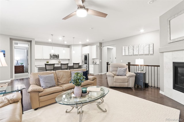 18922 W 84th Ave, Arvada, CO 80007 - living room featuring ceiling fan, recessed lighting, wood finished floors, and a premium fireplace