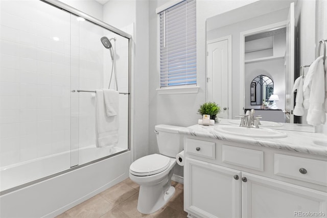 18922 W 84th Ave, Arvada, CO 80007 - bathroom featuring vanity, combined bath / shower with glass door, tile patterned floors, and toilet