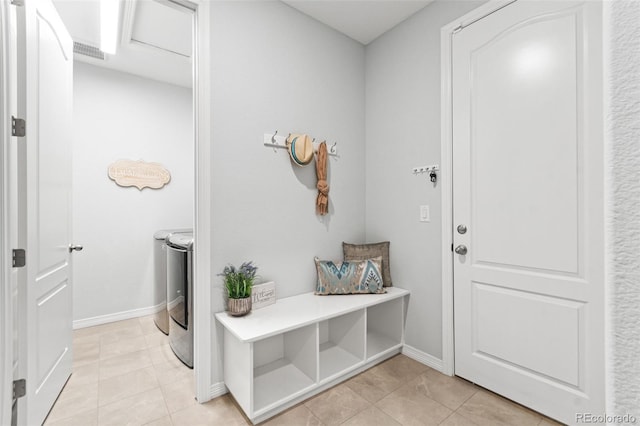 18922 W 84th Ave, Arvada, CO 80007 - mudroom with visible vents, baseboards, independent washer and dryer, and light tile patterned floors