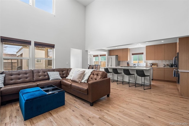 4966 Knox Ct, Denver, CO 80221 - living room with a high ceiling and light wood finished floors