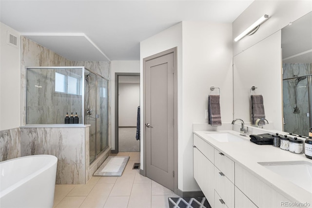 4966 Knox Ct, Denver, CO 80221 - bathroom featuring a shower stall, a soaking tub, double vanity, and tile patterned flooring