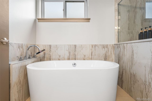 4966 Knox Ct, Denver, CO 80221 - bathroom featuring a freestanding bath, an enclosed shower, and tile walls