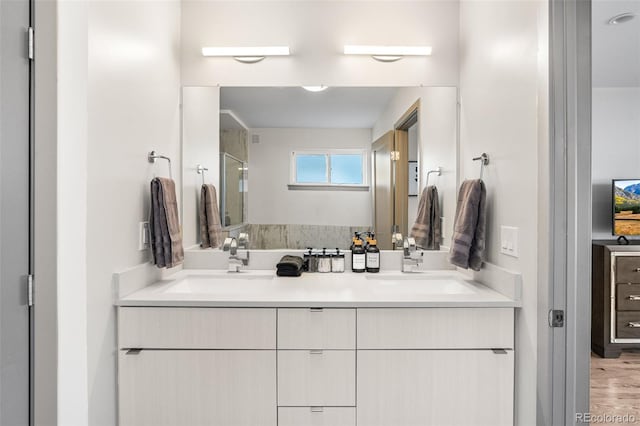 4966 Knox Ct, Denver, CO 80221 - bathroom with double vanity, wood finished floors, and a shower