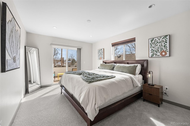 4966 Knox Ct, Denver, CO 80221 - bedroom featuring access to exterior, light colored carpet, multiple windows, and recessed lighting