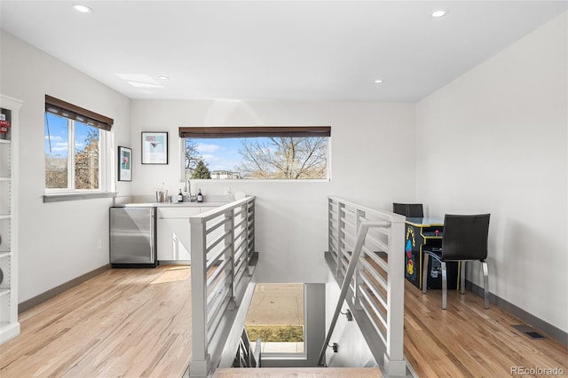 4966 Knox Ct, Denver, CO 80221 - stairway featuring wood finished floors and recessed lighting