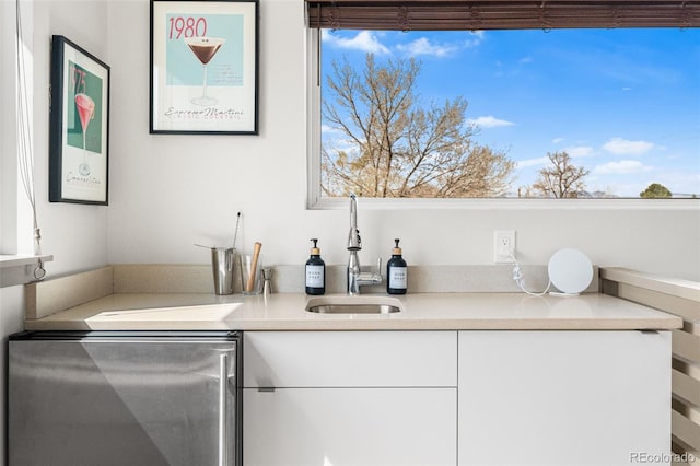 4966 Knox Ct, Denver, CO 80221 - bar featuring fridge and healthy amount of natural light