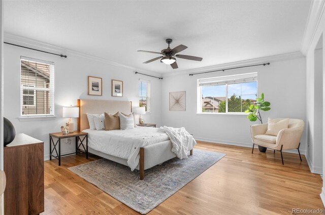 10546 Sundial Rim Rd, Highlands Ranch, CO 80126 - bedroom featuring ornamental molding, light wood-type flooring, baseboards, and ceiling fan