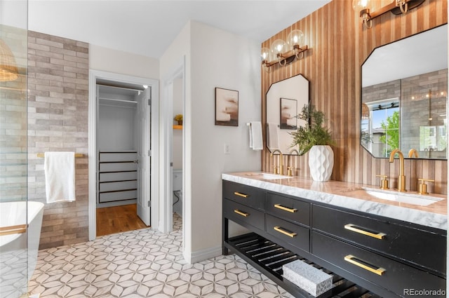 10546 Sundial Rim Rd, Highlands Ranch, CO 80126 - full bath with double vanity, a freestanding tub, tile patterned floors, and toilet