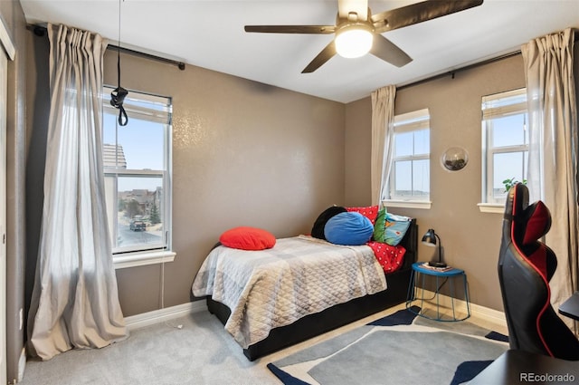 10546 Sundial Rim Rd, Highlands Ranch, CO 80126 - carpeted bedroom featuring baseboards and ceiling fan