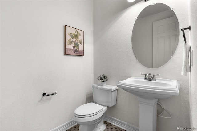10546 Sundial Rim Rd, Highlands Ranch, CO 80126 - half bath featuring toilet and baseboards
