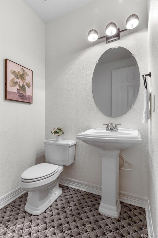 10546 Sundial Rim Rd, Highlands Ranch, CO 80126 - bathroom with toilet and baseboards