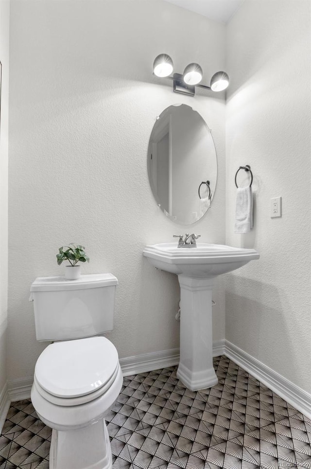 10546 Sundial Rim Rd, Highlands Ranch, CO 80126 - bathroom with toilet and baseboards