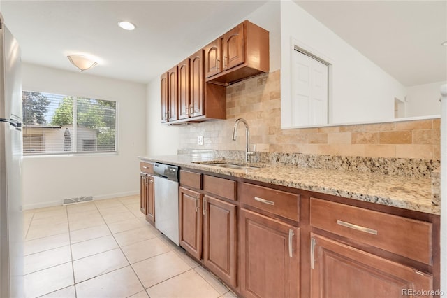 4972 W Custer Pl, Denver, CO 80219 - kitchen featuring dishwasher, light stone counters, tasteful backsplash, light tile patterned floors, and recessed lighting