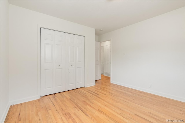 4972 W Custer Pl, Denver, CO 80219 - unfurnished bedroom with light wood-type flooring and a closet
