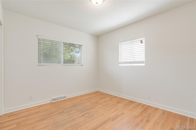 4972 W Custer Pl, Denver, CO 80219 - spare room with light wood-style floors and baseboards