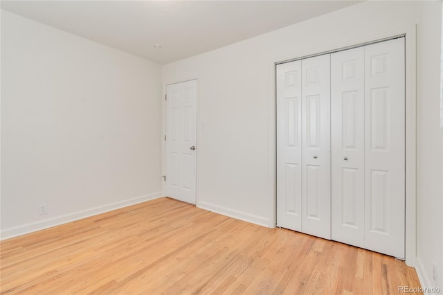 4972 W Custer Pl, Denver, CO 80219 - unfurnished bedroom featuring light wood-style floors and a closet