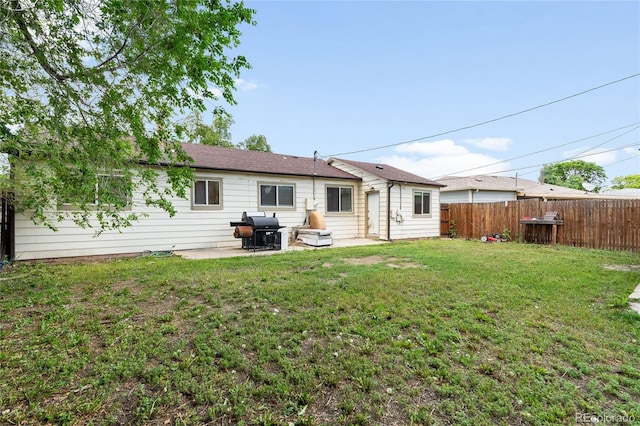 4972 W Custer Pl, Denver, CO 80219 - rear view of property featuring a patio