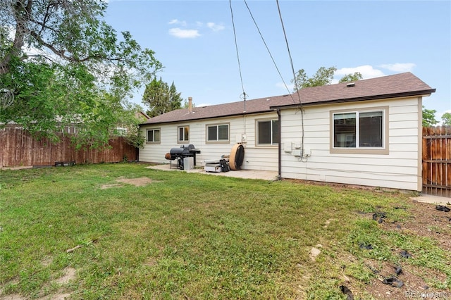 4972 W Custer Pl, Denver, CO 80219 - rear view of property with a fenced backyard and a patio area