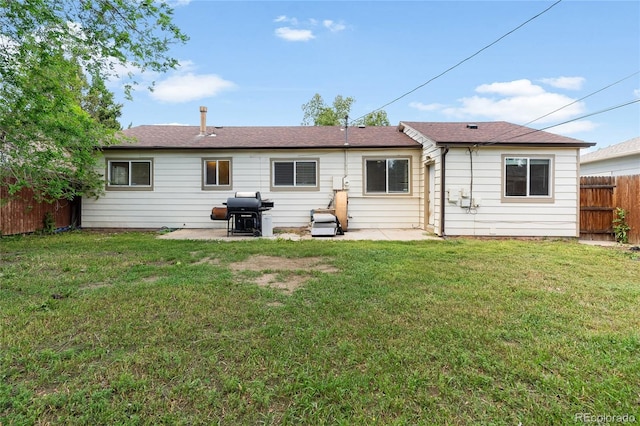 4972 W Custer Pl, Denver, CO 80219 - back of house with a patio area