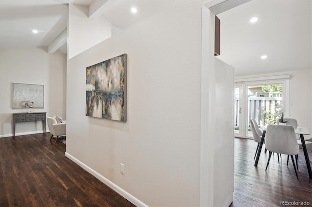 corridor featuring vaulted ceiling with beams and dark hardwood / wood-style floors