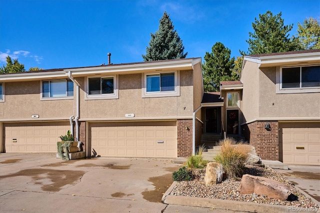 multi unit property featuring a garage