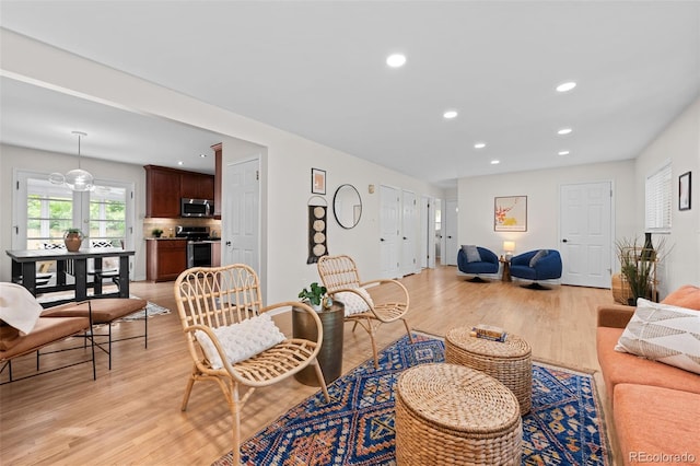 6402 Iris Ct, Arvada, CO 80004 - living area with light wood finished floors and recessed lighting
