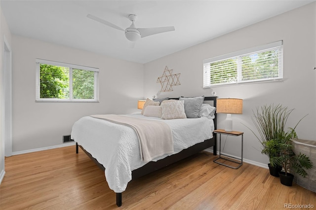 6402 Iris Ct, Arvada, CO 80004 - bedroom featuring light wood-type flooring, baseboards, and ceiling fan