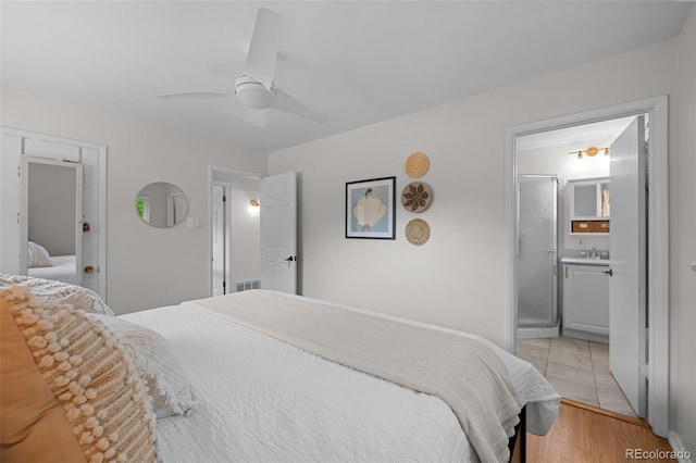 6402 Iris Ct, Arvada, CO 80004 - bedroom featuring a sink, ceiling fan, and connected bathroom